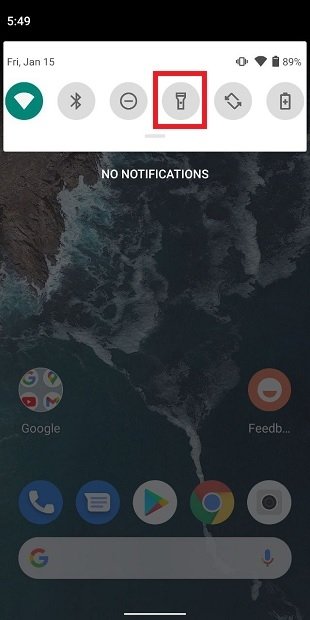 Turn on the flashlight from the quick settings